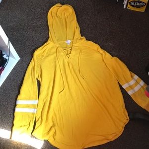 A long sleeve shirt very comfortable has a hood.
